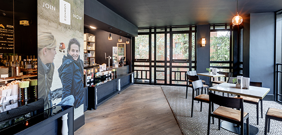 Box office area with wooden flooring, glass panels and a cardboard cutout