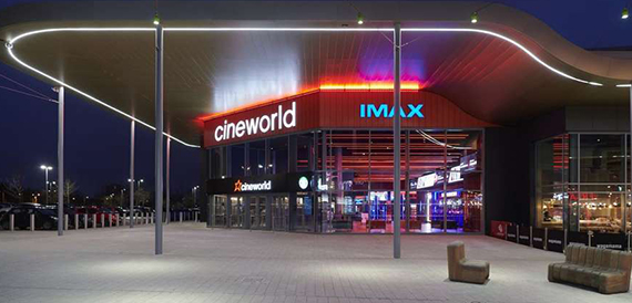 Cineworld Leeds' exterior lit up at night with IMAX signage