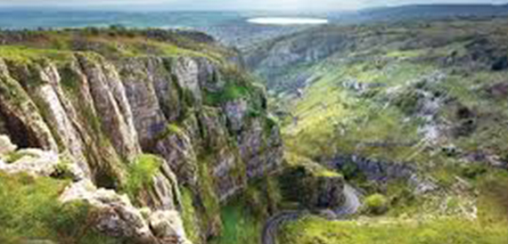 Aerial view over Cheddar Gorge's green hills and limestone cliffs