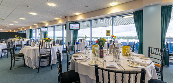 Private box with a table set for dining overlooking the racecourse