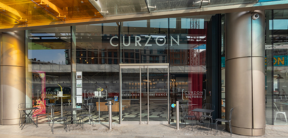 Curzon's glass entrance with revolving doors and a chequered floor