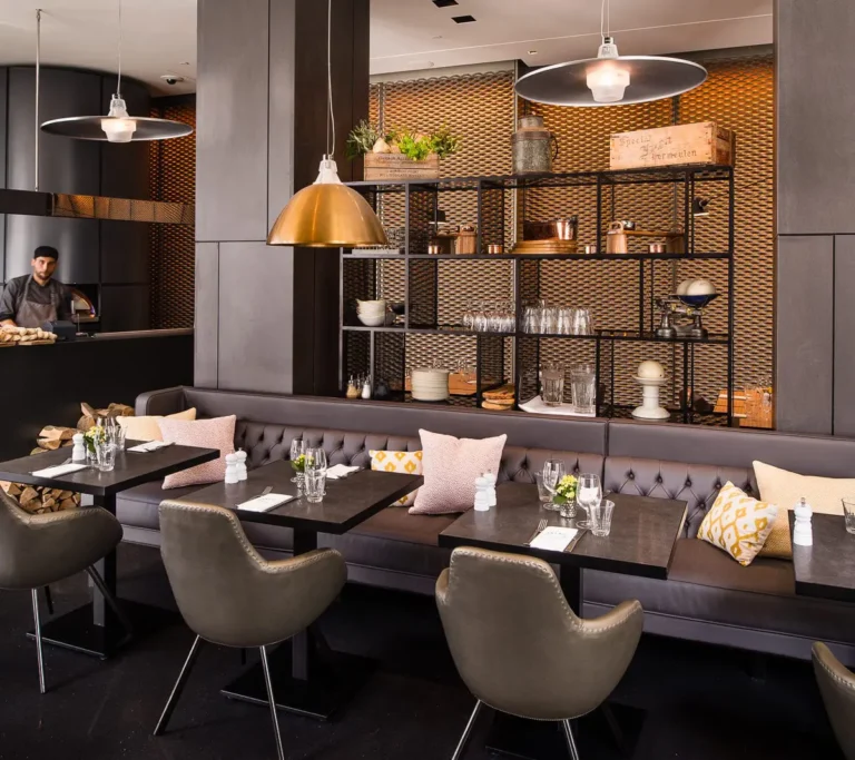 Florentine Trattoria restaurant with leather booth seating, pendant lights and copper shelving.