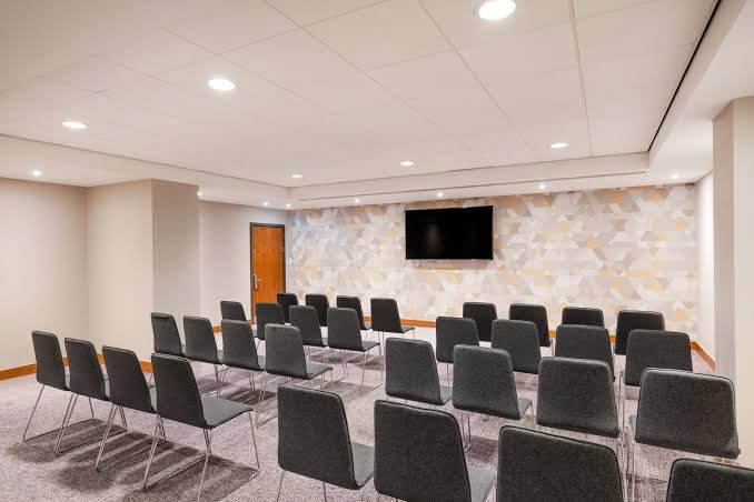 Planet Suite set theatre-style with rows of chairs facing a wall screen
